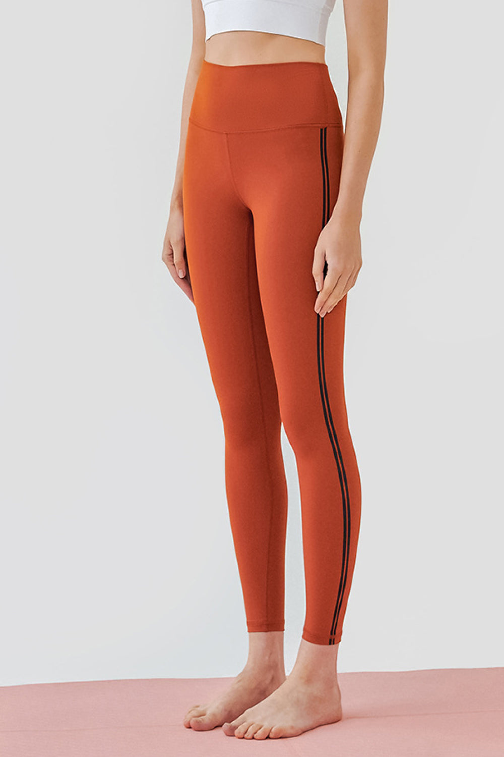 High Waist Side Stripe Yoga Leggings High Waist Side Stripe Yoga Leggings - M&R CORNER Trendsi Tangerine / 4